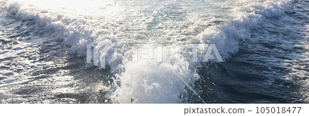 Yacht engine and long water trail with spray and foam behind. Yacht engine and long water trail with spray and foam behind. 105018477