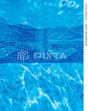 Underwater view of blue pool liner with swimming dolphin pattern Underwater view of blue pool liner with swimming dolphin pattern 105021523