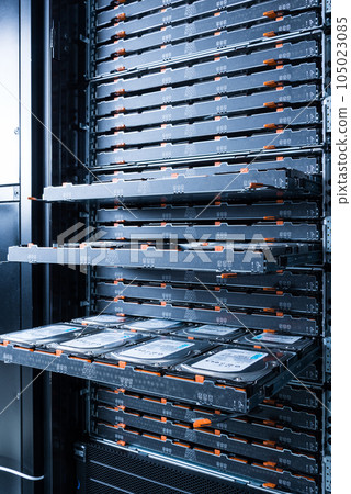 Cluster of hard drives inside open tray - a cloud data storage concept 105023085