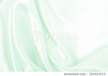 Smooth elegant green silk or satin luxury cloth texture as abstract background. Luxurious background design 105024313