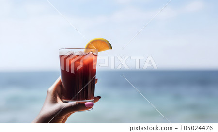african american hand holding glass of cocktail on blurry sea horizon background at sunny day, neural network generated image 105024476