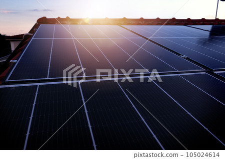 Renewable energy system with solar panel on the roof Renewable energy system with solar panel on the roof 105024614