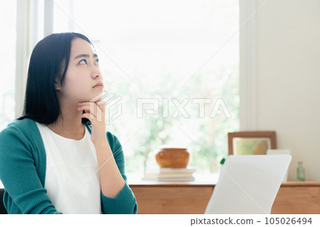 A young woman working on a computer A young woman working on a computer 105026494