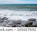 The Mediterranean Sea powerful waves crashing over the rocks in stormy weather. 105027692