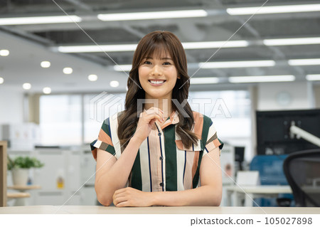 Smiling young woman looking at camera Casual business image portrait 105027898