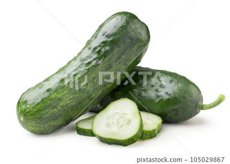 Ripe cucumbers and sliced pieces on a white background. Isolated Ripe cucumbers and sliced pieces on a white background. Isolated 105029867