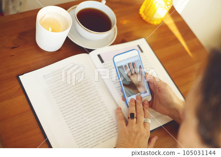Fortune teller reading palm lines during online palmistry consultation Fortune teller reading palm lines during online palmistry consultation 105031144