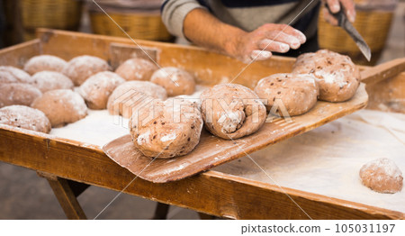 bread preparation. loaves of dough before baking bread preparation. loaves of dough before baking 105031197