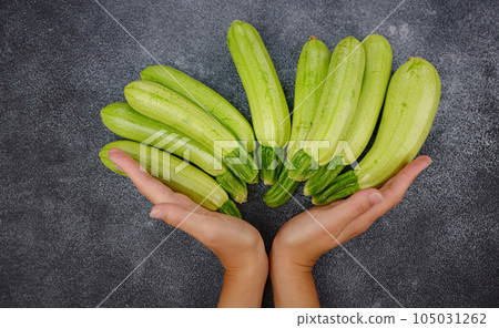 Fresh zucchini, green vegetables on local farmer market 105031262