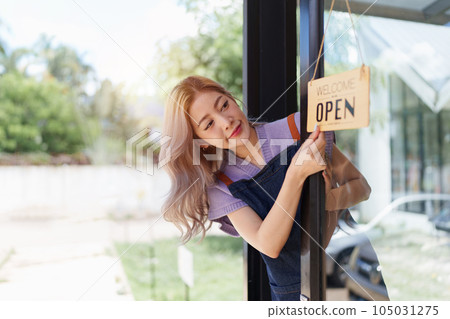 Asian cafe owner or barista standing with smiling at cafe. woman small business owner in food and beverage Asian cafe owner or barista standing with smiling at cafe. woman small business owner in food and beverage 105031275