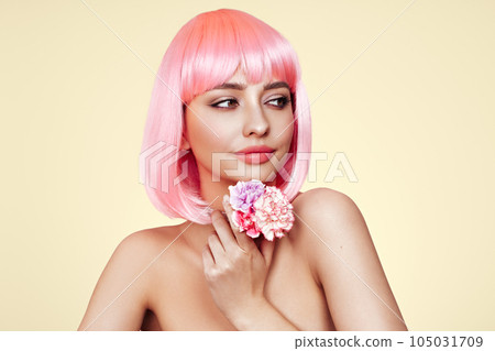 Beauty model portrait with pink hair and carnation flowers Beauty model portrait with pink hair and carnation flowers 105031709