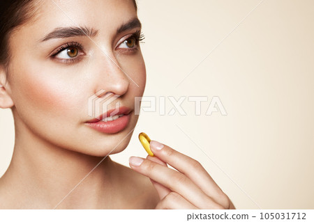 Beautiful Girl With Pill With Cod Liver Oil Omega-3 105031712