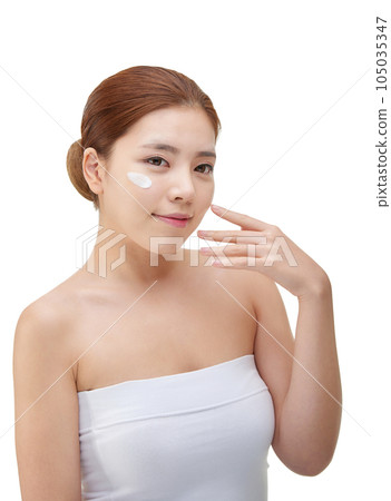 beautiful young woman with clean skin and moisturizing cream beautiful young woman with clean skin and moisturizing cream 105035347