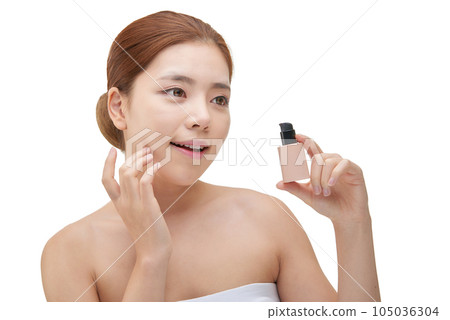 portrait of a young woman taking care of her skin 105036304