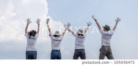 Group of volunteers cheerful success jumping together and arms raised. clean up garbage. Group of volunteers cheerful success jumping together and arms raised. clean up garbage. 105036472