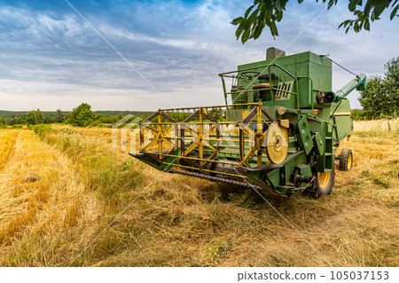 Old green combine harvester Old green combine harvester 105037153