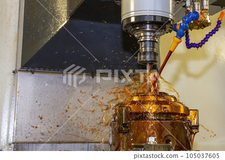 The CNC milling machine cutting the shell mold parts with oil coolant method . 105037605