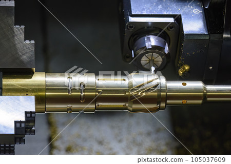 The CNC lathe machine slot milling the brass shaft parts by milling spindle. The CNC lathe machine slot milling the brass shaft parts by milling spindle. 105037609
