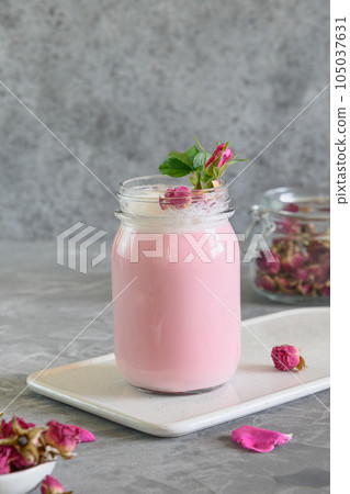 Rose moon milk in mason jar on grey background. 105037631