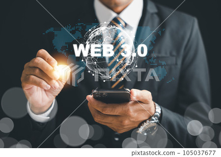 Embracing the Web 3.0 revolution, a businessman contemplates mobile phone strategies to capitalize on the futuristic trends of metaverse, blockchain, and fintech. web3 concept 105037677