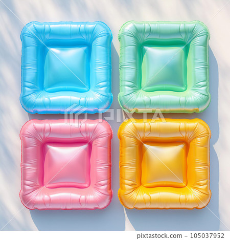 Square Colorful Air Mattress on the Beach Sand Square Colorful Air Mattress on the Beach Sand 105037952