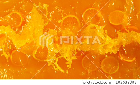 Freeze motion of mixing orange juice in twister shape. Filmed on high speed cinema camera, 1000 fps. Freeze motion of mixing orange juice in twister shape. Filmed on high speed cinema camera, 1000 fps. 105038395