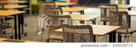 Empty classroom or conference room with desks and chairs Empty classroom or conference room with desks and chairs 105038717