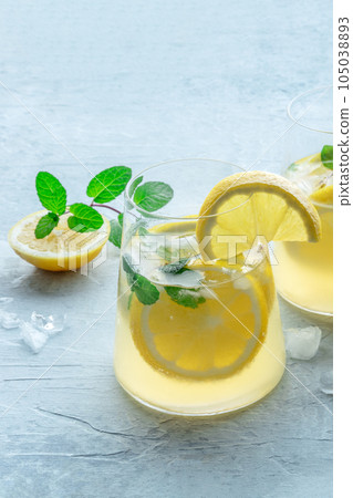Lemonade with mint. Lemon water drink with ice. Detox beverage Lemonade with mint. Lemon water drink with ice. Detox beverage 105038893