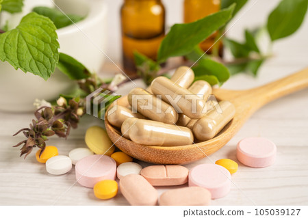 Alternative medicine herbal organic capsule with vitamin E omega 3 fish oil, mineral, drug with herbs leaf natural supplements for healthy good life. 105039127