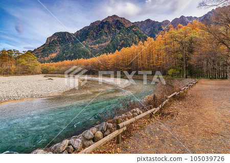 Kamikochi Japan, Nature landscape at Kamikochi Japan, autumn fall foliage with pond and mountain Kamikochi Japan, Nature landscape at Kamikochi Japan, autumn fall foliage with pond and mountain 105039726