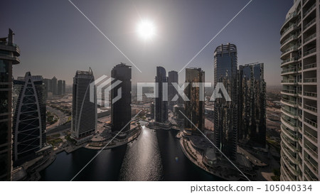 Sunrise over tall residential buildings at JLT aerial all day timelapse Sunrise over tall residential buildings at JLT aerial all day timelapse 105040334