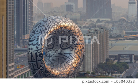 Museum of the Future exhibition space aerial night to day timelapse with iconic torus shape Museum of the Future exhibition space aerial night to day timelapse with iconic torus shape 105040358