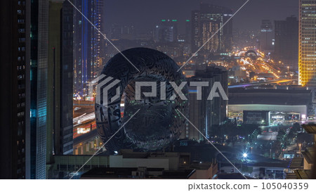 Museum of the Future exhibition space aerial day to night timelapse with iconic torus shape Museum of the Future exhibition space aerial day to night timelapse with iconic torus shape 105040359