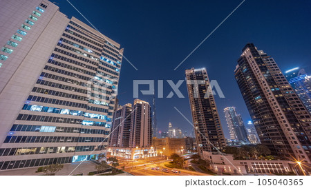 Aerial panoramic view to Dubai downtown and difc skyscrapers day to night timelapse. Aerial panoramic view to Dubai downtown and difc skyscrapers day to night timelapse. 105040365
