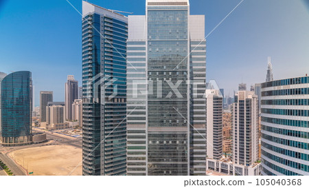 Cityscape skyscrapers of Dubai Business Bay with water canal aerial timelapse. Cityscape skyscrapers of Dubai Business Bay with water canal aerial timelapse. 105040368