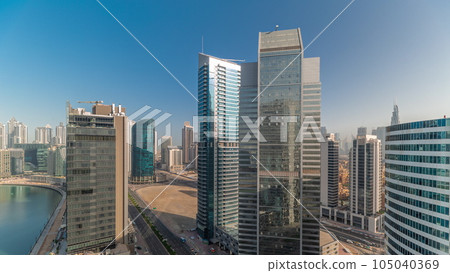 Cityscape skyscrapers of Dubai Business Bay with water canal aerial timelapse. Cityscape skyscrapers of Dubai Business Bay with water canal aerial timelapse. 105040369