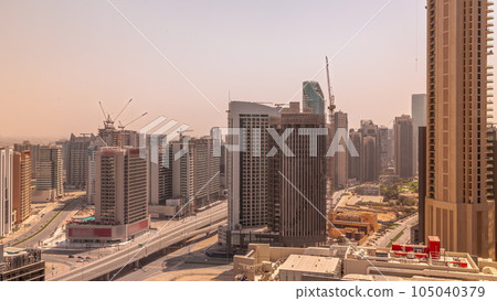Skyscrapers at the Business Bay in Dubai aerial all day timelapse, United Arab Emirates 105040379