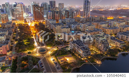 Skyscrapers in Barsha Heights district and low rise buildings in Greens district aerial day to night timelapse. Skyscrapers in Barsha Heights district and low rise buildings in Greens district aerial day to night timelapse. 105040401