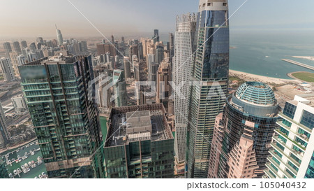 Panorama showing Dubai Marina and JLT with JBR district. Ttraffic on highway between skyscrapers aerial timelapse. Panorama showing Dubai Marina and JLT with JBR district. Ttraffic on highway between skyscrapers aerial timelapse. 105040432