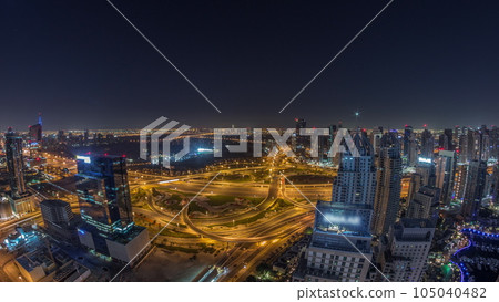 Huge highway crossroad junction between JLT district and Dubai Marina all night timelapse. Huge highway crossroad junction between JLT district and Dubai Marina all night timelapse. 105040482