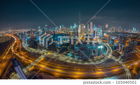Panoramic skyline of Dubai with business bay and downtown district day to night timelapse. 105040501