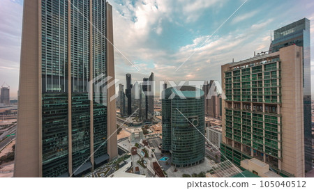 Dubai international financial center skyscrapers aerial night to day timelapse. 105040512