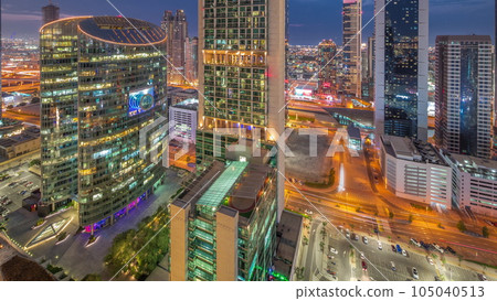 Dubai international financial center skyscrapers aerial day to night timelapse. Dubai international financial center skyscrapers aerial day to night timelapse. 105040513