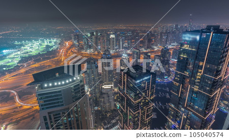 Panorama of Dubai Marina with JLT skyscrapers day to night timelapse, Dubai, United Arab Emirates. Panorama of Dubai Marina with JLT skyscrapers day to night timelapse, Dubai, United Arab Emirates. 105040574