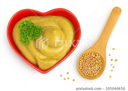 Mustard sauce in ceramic bowl with seed isolated on white background. Top view. Flat lay Mustard sauce in ceramic bowl with seed isolated on white background. Top view. Flat lay 105040638