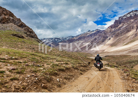Bike on mountain road in Himalayas. Spiti Valley, Himachal Pradesh, India Bike on mountain road in Himalayas. Spiti Valley, Himachal Pradesh, India 105040674