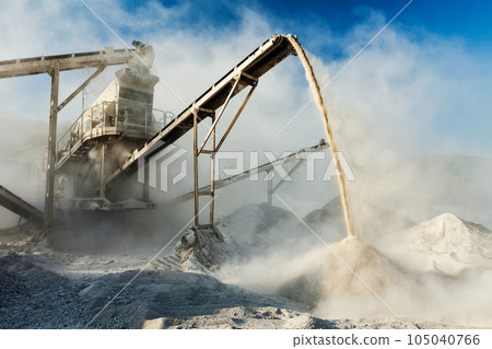 Industrial background - crusher rock stone crushing machine at open pit mining and processing plant for crushed stone, sand and gravel Industrial background - crusher rock stone crushing machine at open pit mining and processing plant for crushed stone, sand and gravel 105040766
