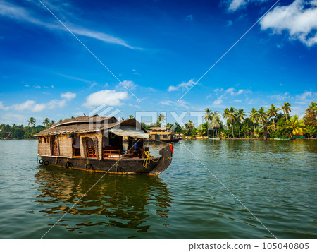 Travel tourism Kerala background - houseboat on Kerala backwaters. Kerala, India Travel tourism Kerala background - houseboat on Kerala backwaters. Kerala, India 105040805
