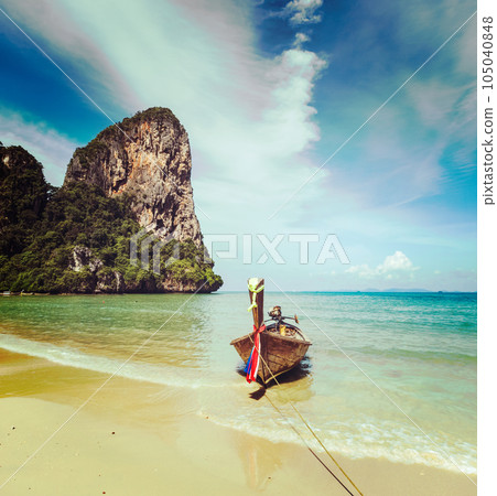 Vintage retro effect filtered hipster style travel image of long tail boat on tropical beach, Krabi, Thailand Vintage retro effect filtered hipster style travel image of long tail boat on tropical beach, Krabi, Thailand 105040848