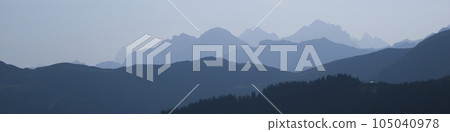 Mountain ranges in the morning light seen from Vorder Walig, Switzerland. Nature header Swiss mountains. 105040978